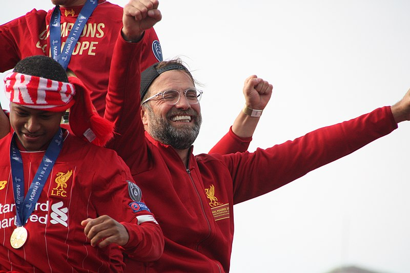 Jurgen Klopp celebrating Liverpool's 2019 Champions League victory at a parade.